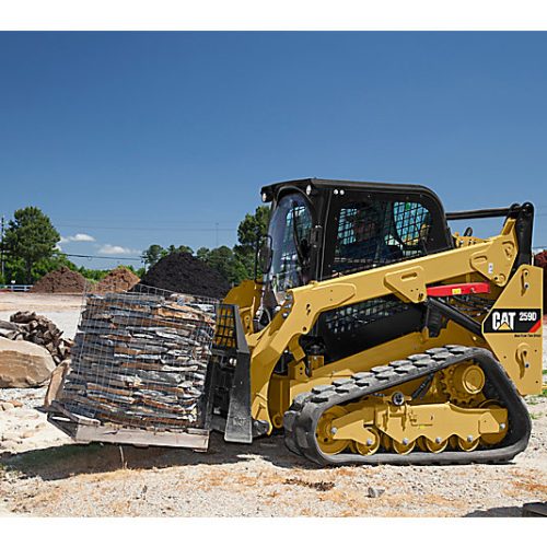 Skid steer loader CAT 259D lifting stones