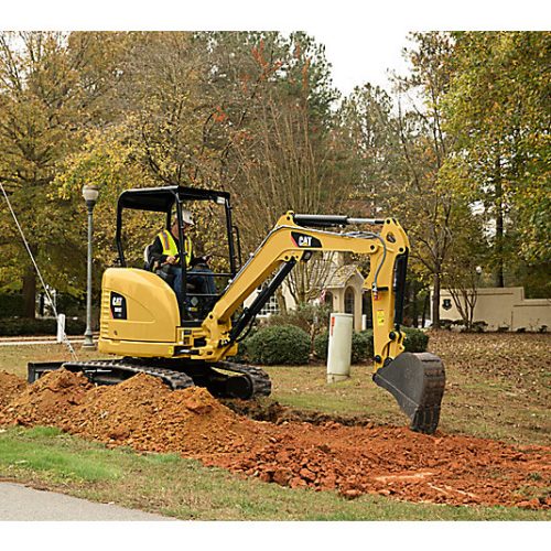 Mini Excavator CAT 303ECR digging ground