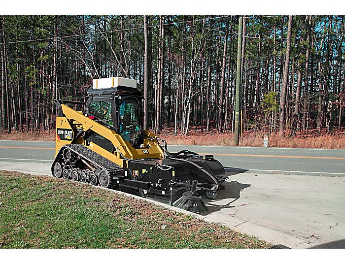 Pickup Brooms BP118C for compact loaders (226 / 249 / 259 /262) in action with excavator