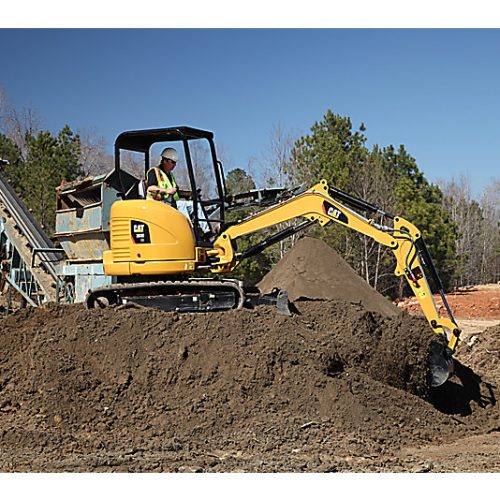 Mini Excavator CAT 303ECR at jobsite